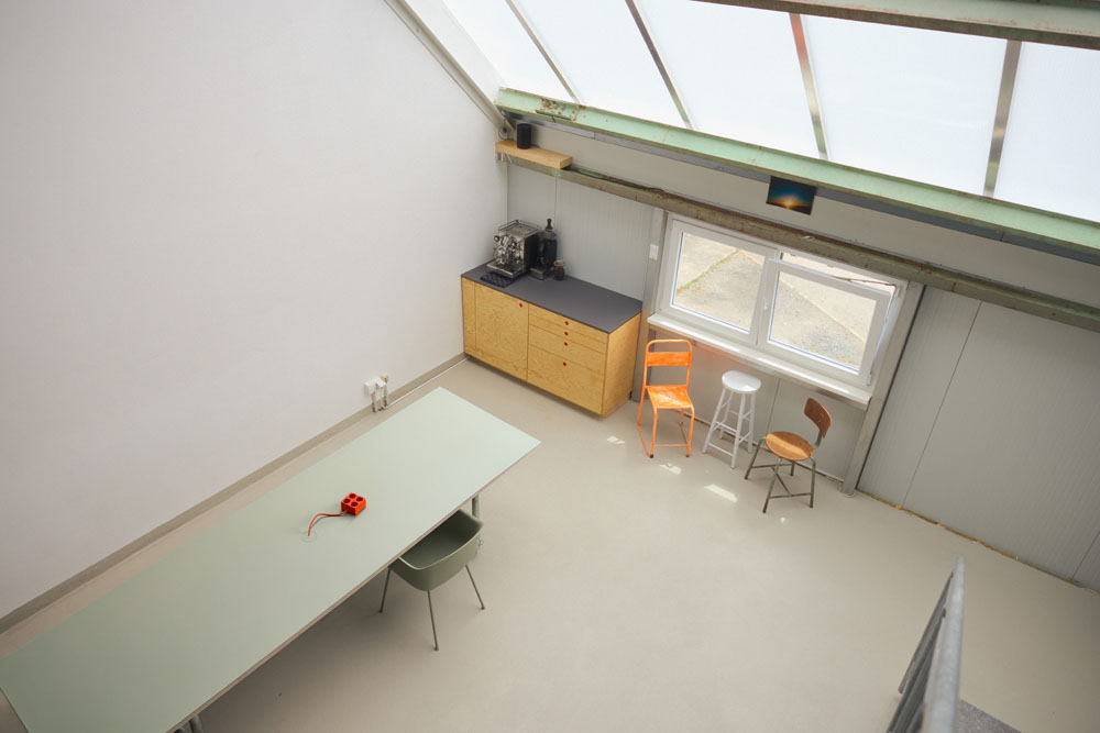 Meeting and coffee area from above with espresso machine