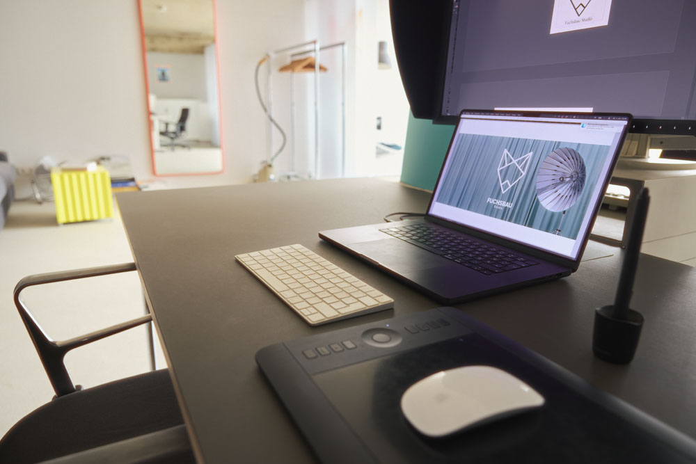 Workdesk with laptop, EIZO monitor and Wacom graphics tablet